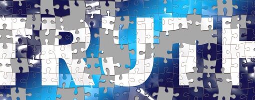 A puzzle of the word "TRUTH" with some pieces missing.